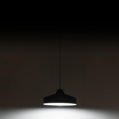 Black pendant light against a dark background